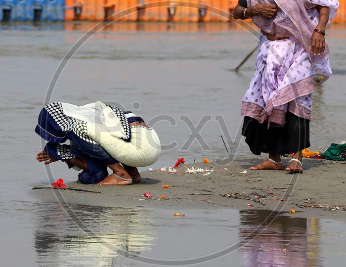 Hindu Devotee Offering Prayers To Holy River Triveni Sangam In Prayagraj On May 30,2020