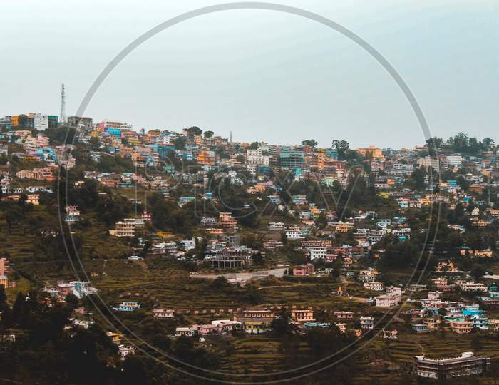 A Landscape Of A City In The Mountains, Captured From A Tele Photo Lens.