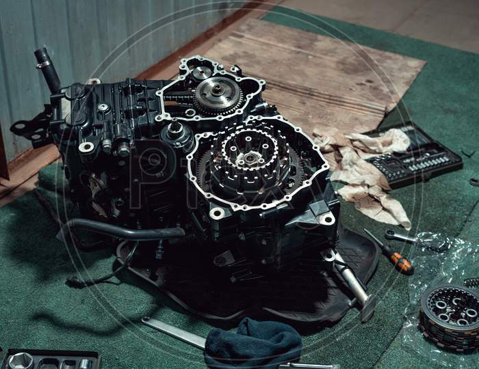 Disassembled fast motorcycle engine with visible clutch
