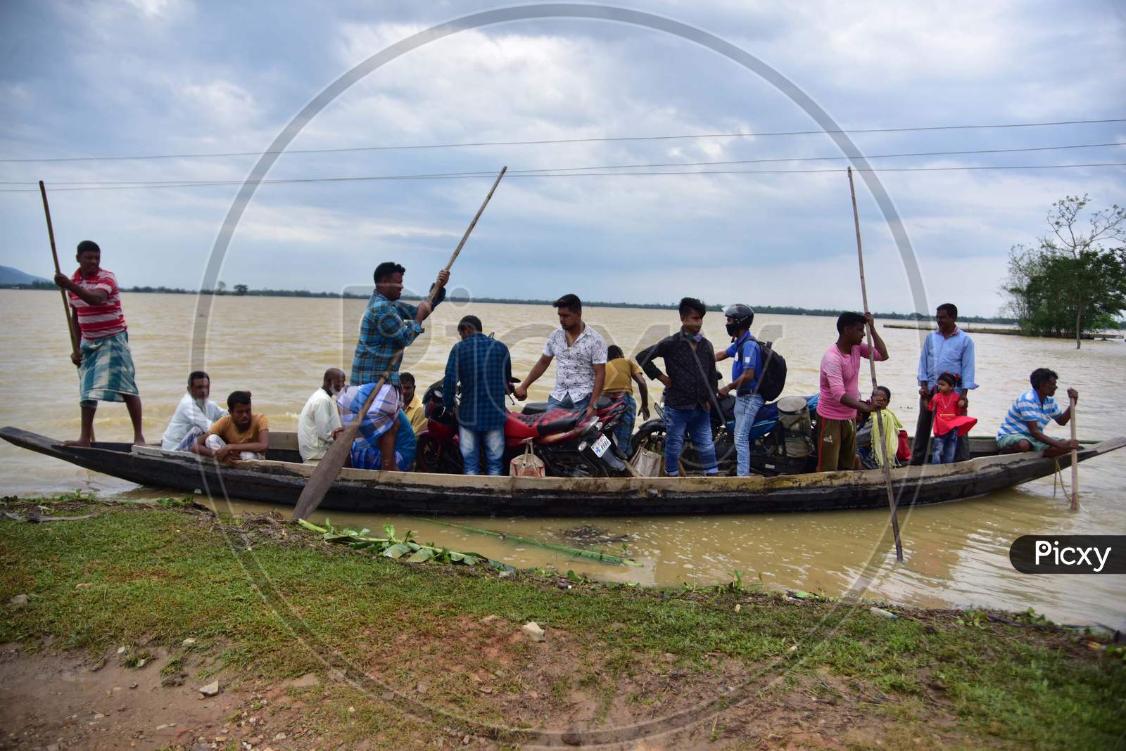 Flood Affected Villagers Are Transported on A Boat To A Safer Place In Hojai District of Assam On May 30,2020