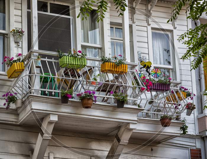 beautiful white wooden balcony with flowers