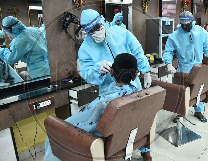 Barbers Wear Ppe Suits While Working At A Salon, During The Ongoing Coronavirus Lockdown, In Vijayawada.