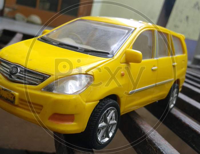 yellow taxi toy car standing