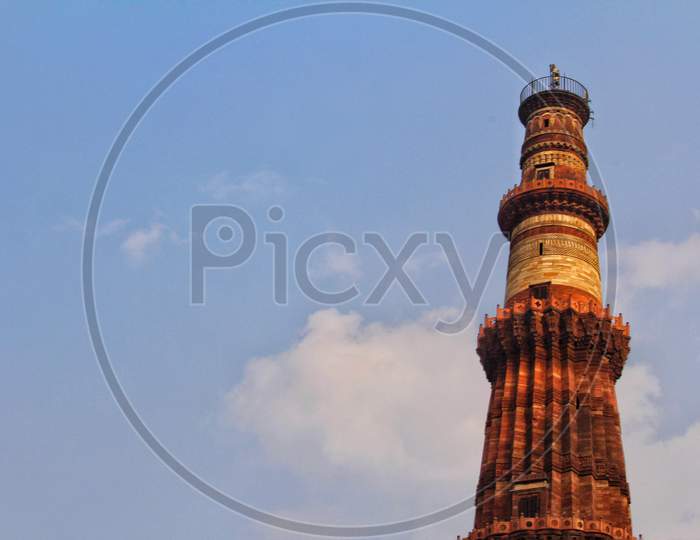 Delhi, India - 7 March 2019, Qutub Minar, A Minaret That Forms Part Of The Qutab Complex, A Unesco World Heritage Site In The Mehrauli Area Of Delhi