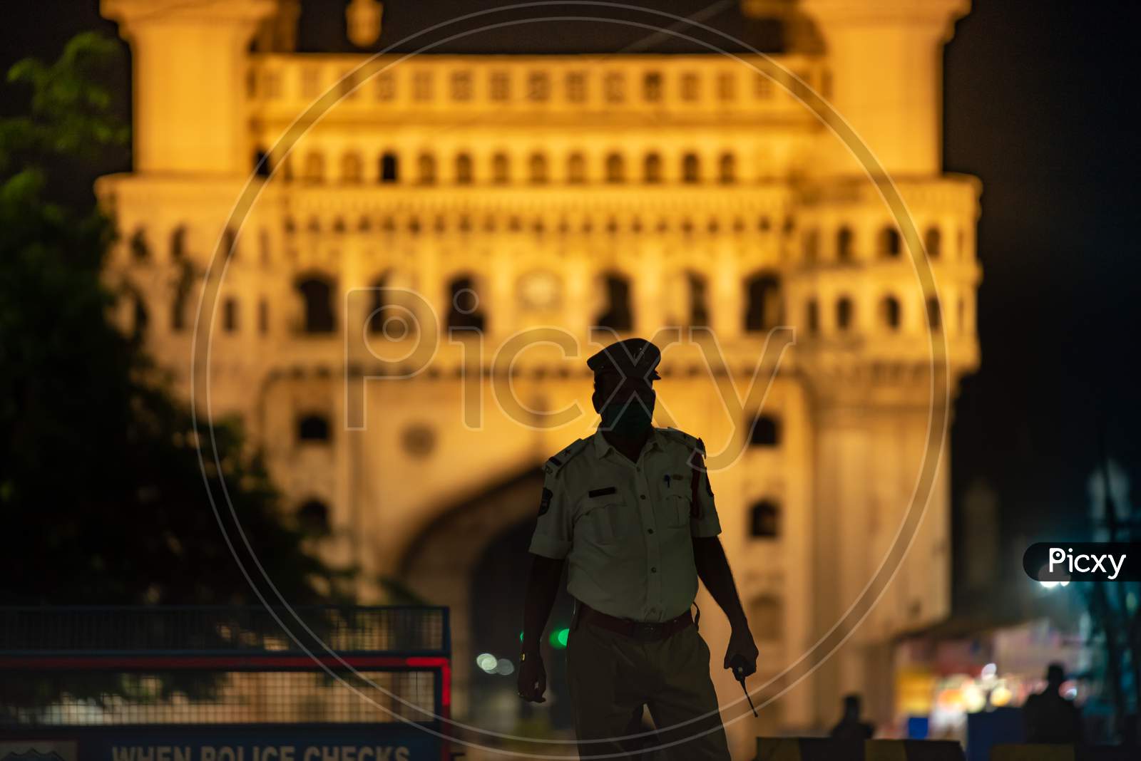 A Hyderabad Traffic Police Officer stands guard at Charminar to impose Night Curfew during the ongoing Lockdown amid Coronavirus Pandemic.  Charminar, Hyderabad, May 30, 2020.