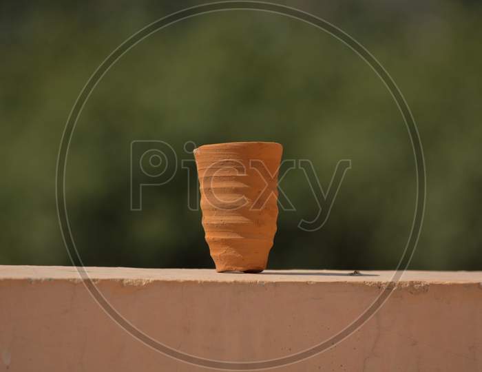 Cup Made Of Mud Or Sand Called Kulhad/Kullhad Used To Serve Authentic Indian Drinks Called Lassie/Lassi, Milk, Tea. Hand Made Earthenware Pot