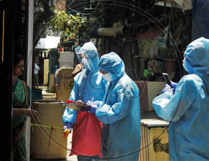 The doctors wearing protective suits are seen asking for health details from the residents of Dharavi, as a precautionary measure against the spread of the coronavirus disease (COVID-19), in Mumbai, India, April 12, 2020.