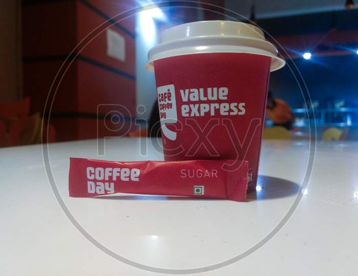 New Delhi, India - March 25, 2019 : Cafe Coffee Day Coffee With Sugar Pouch