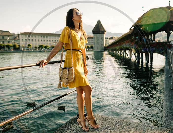 Fashion Woman In Summer Dress Travelling Europe On Vacation, Switzerland.