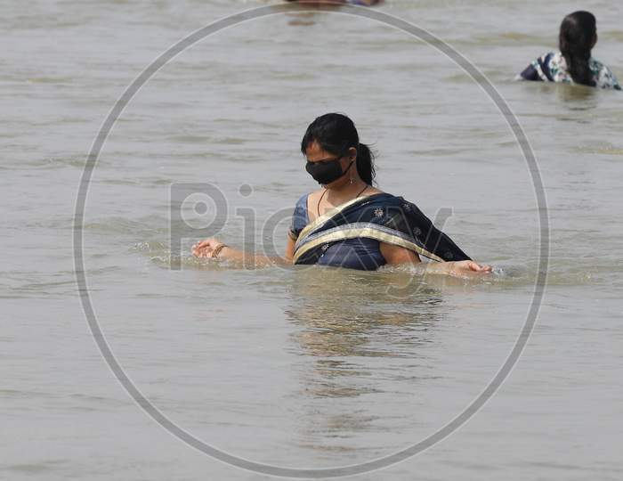 A Hindu Woman Devotee Taking A Holy Dip In Ganga River In Prayagraj on May 31, 2020