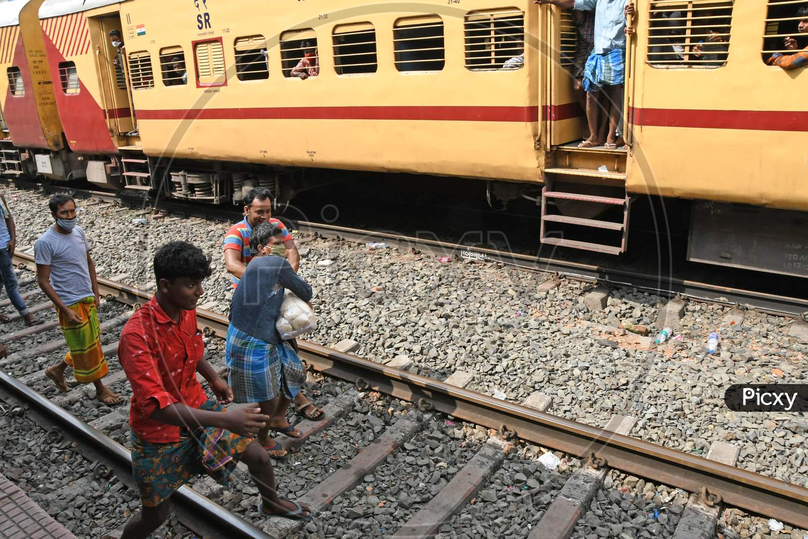 Migrant workers stranded in other states due to lockdown in the emergence of Novel Coronavirus (COVID-19) situation are being given free food by the railway department on their way home.