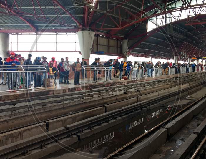 Delhi, India - March 29, 2019: People Wait For Metro Train In Kashmiri Gate Station. Delhi