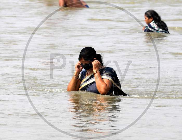A Hindu Woman Devotee Taking a Holy Dip In Ganga River In Prayagraj on May 31, 2020