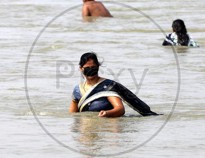 A Hindu Woman Devotee Taking A Holy Dip In Ganga River In Prayagraj on May 31, 2020