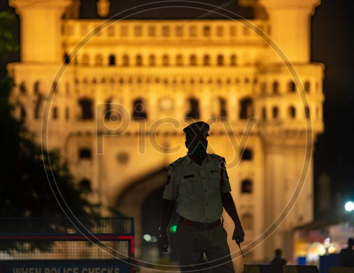A Hyderabad Traffic Police Officer stands guard at Charminar to impose Night Curfew during the ongoing Lockdown amid Coronavirus Pandemic.  Charminar, Hyderabad, May 30, 2020.
