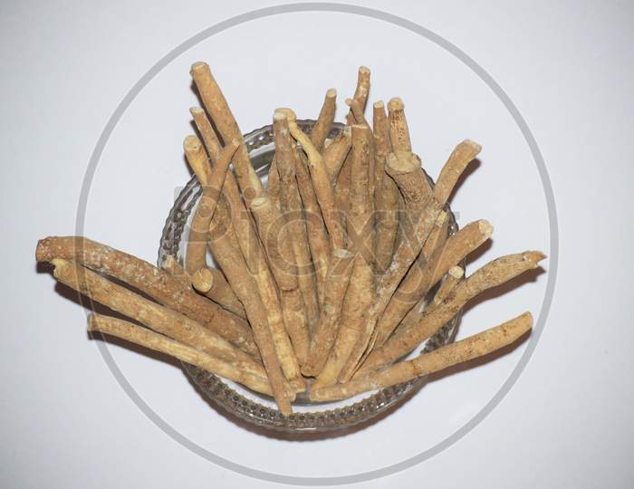 Ashwagandha Or Withania Somnifera Also Known As Indian Ginseng Or Poison Gooseberry Or Winter Cherry Is Ayurvedic Dried Plant Herb With Health Benefits.