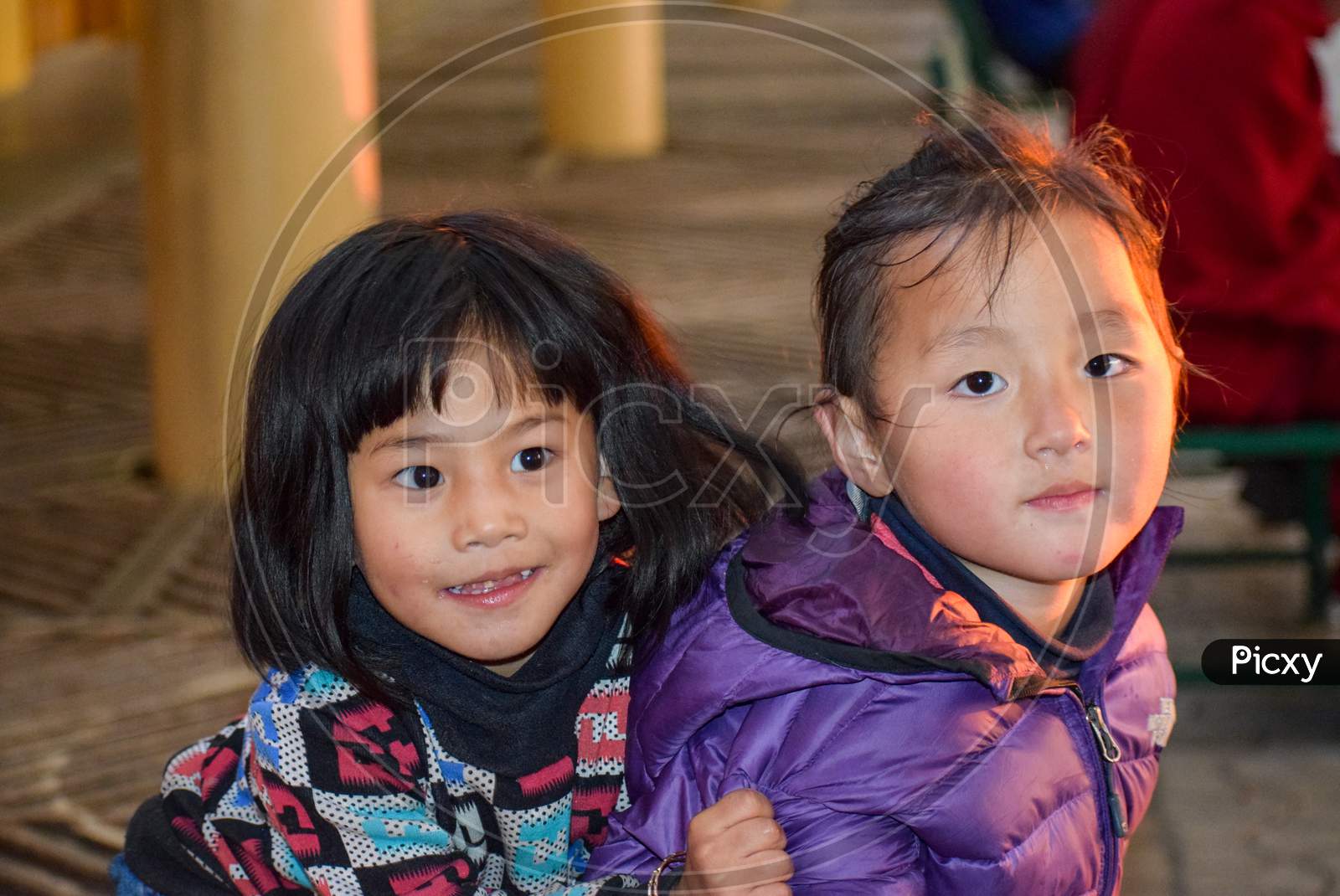 Dharamshala, India 2016 : Two Cute Chinese girls playing and posing for photographs. Images are captured in Dharamshala which is considered as a place of political asylum for Dalai Lama