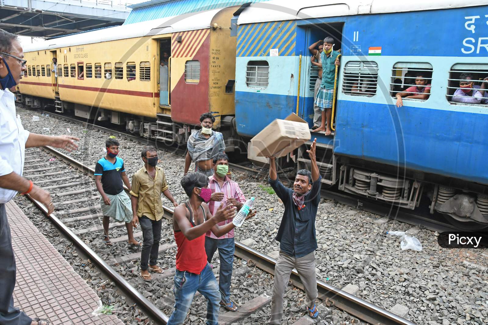 Migrant workers stranded in other states due to lockdown in the emergence of Novel Coronavirus (COVID-19) situation are being given free food by the railway department on their way home.