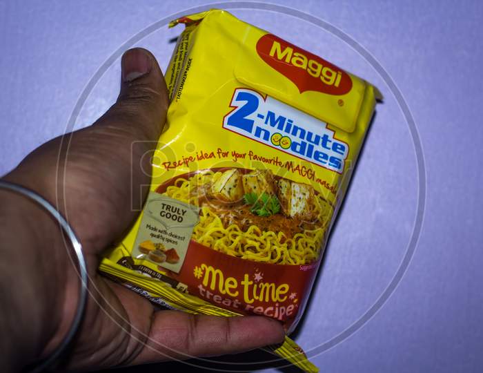 Delhi, India - January 14Th 2020: Hand Holding Brand Maggi Instant Noodle