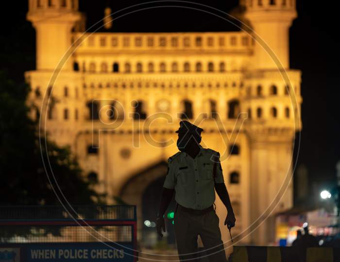 A Hyderabad Traffic Police Officer stands guard at Charminar to impose Night Curfew during the ongoing Lockdown amid Coronavirus Pandemic. Charminar, Hyderabad, May 30, 2020.