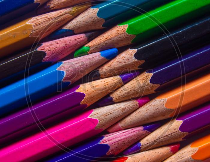 Color Pencils Arranged In A Creative Way. Student Art Supplies.