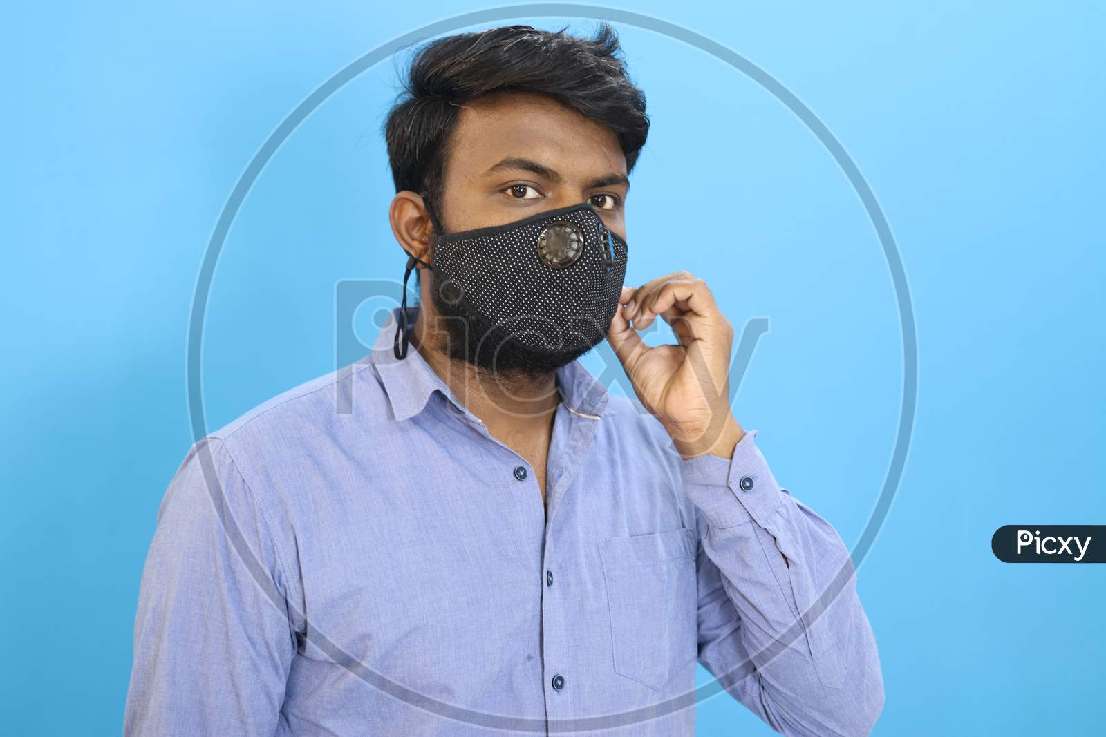 Indian man with a mask on sky background