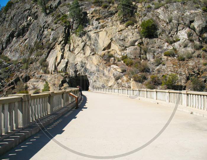 Pathway Along The Dam Leading To A Cave And Then Hiking Paths.