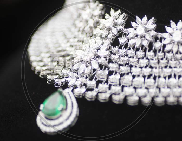 Diamond jewelry with green gemstone