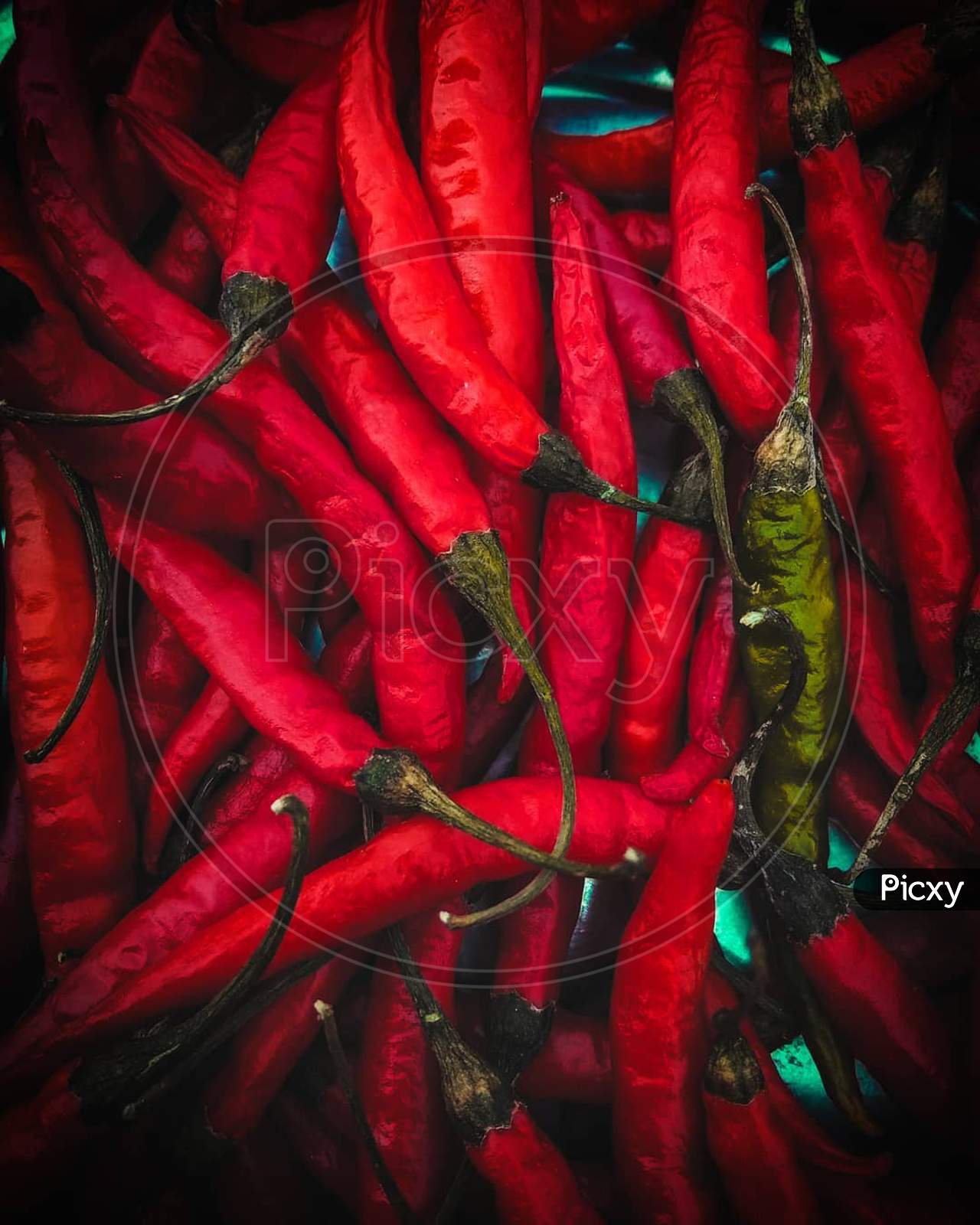 Heap of red chillis in market place