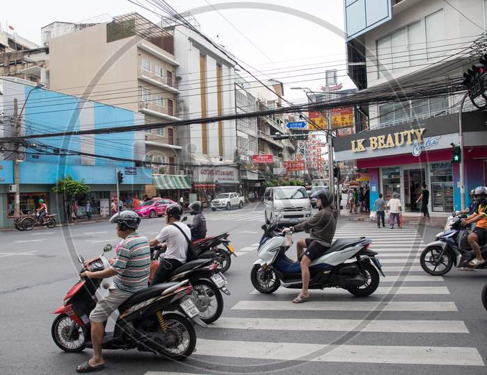 People moving on Roads on Scooters
