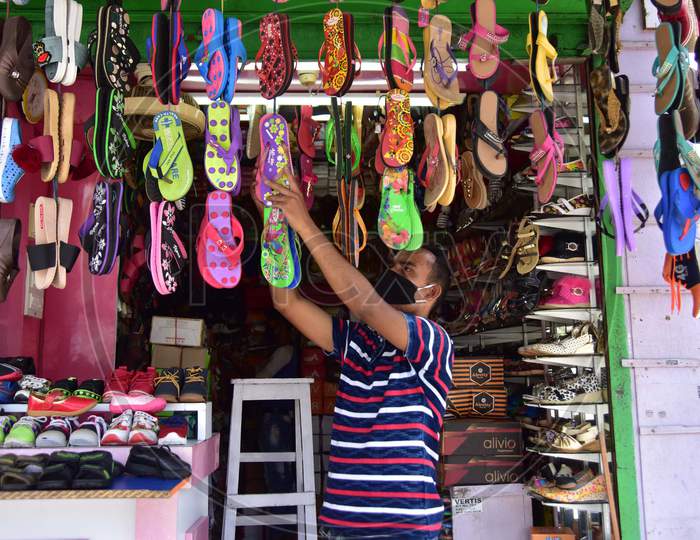 A  Shopkeeper arranges Shoes For Sale  After Authorities Allowed  With Certain Restrictions, During The Ongoing Covid-19 Or Coronavirus  Nationwide Lockdown In Nagaon District Of Assam On May 04,2020