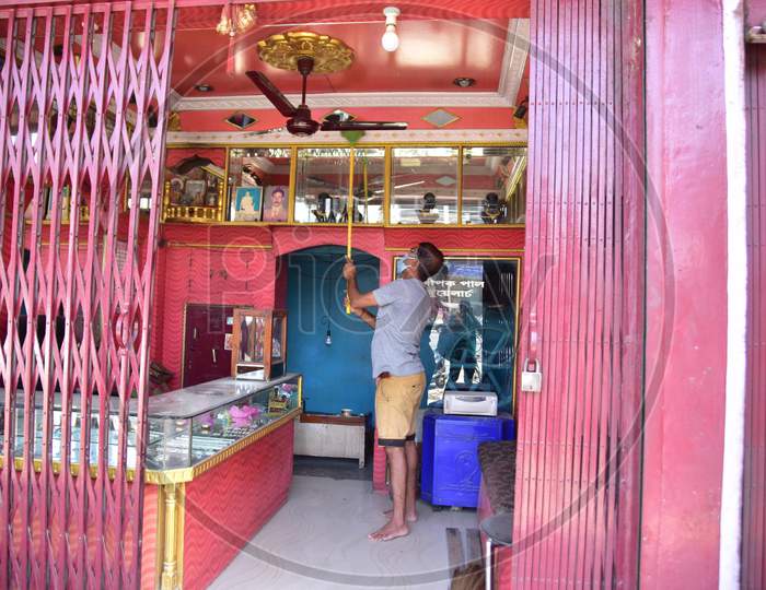 Nagaon : A  Man Claen His Jewellery Shop  After Authorities Allowed Sale  With Certain Restrictions, During The Ongoing Covid-19 Nationwide Lockdown In Nagaon District Of Assam On May 04,2020 .Pix By Anuwar Hazarika