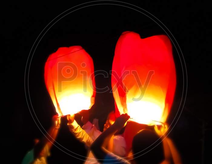 kids are holding air lamp or air balloon on Diwali festival