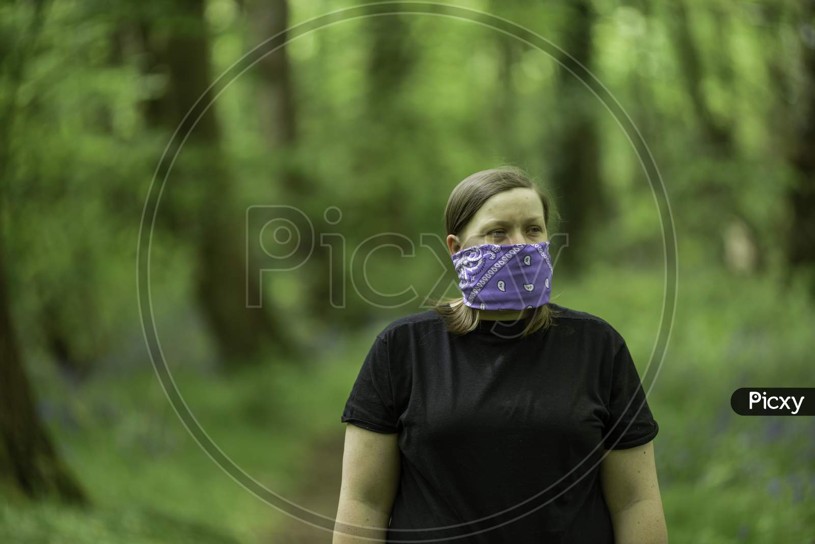 Young women wearing a handmade face mask during Coronavirus pandemic in the UK.