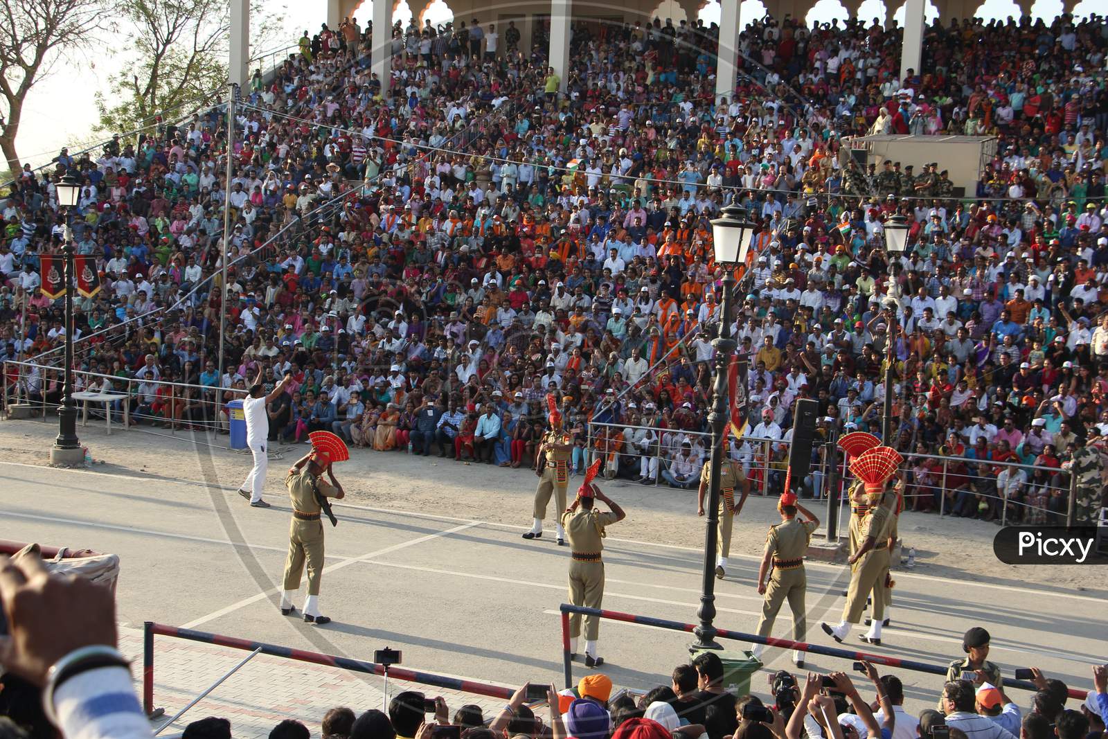Indian crowd cheering and celebrating Border Security Force of Indian Army at Wagha Border, India. Amritsar, Punjab, India