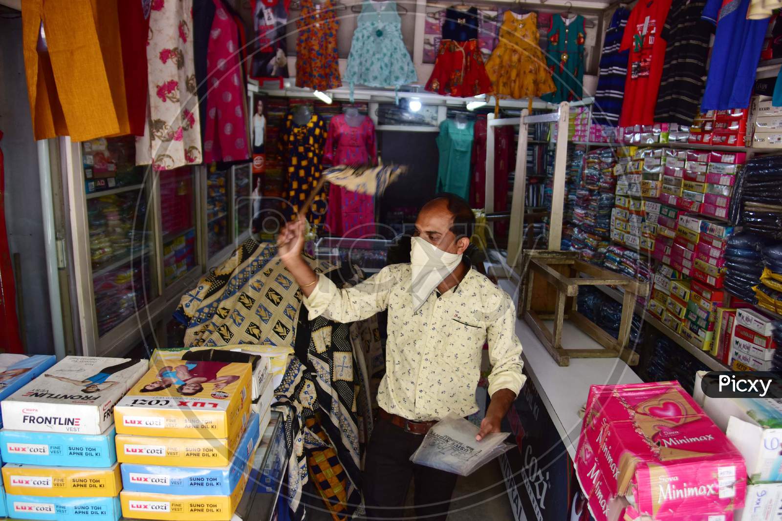 Nagaon : Shopkeepeer Claen Their Garment Shop   After Authorities Allowed Sale   With Certain Restrictions, During The Ongoing Covid-19 Nationwide Lockdown In Nagaon District Of Assam On May 04,2020 .Pix By Anuwar Hazarika