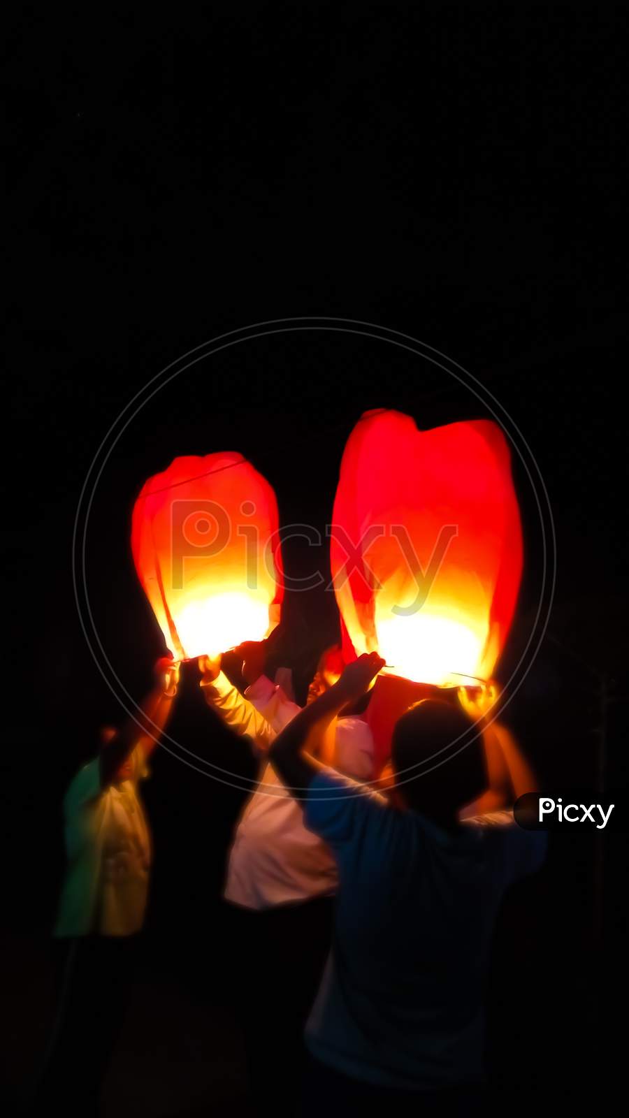 kids are holding air lamp or air balloon on Diwali festival