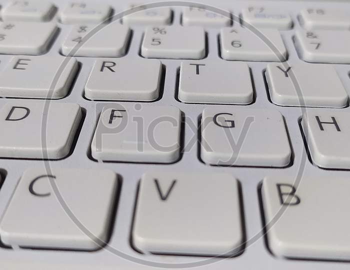 Laptop white keyboard closeup shot