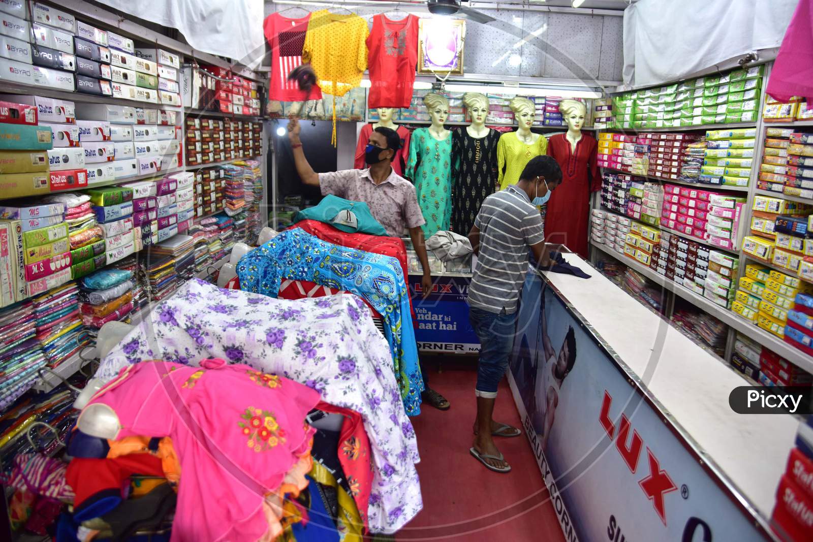 Nagaon : Shopkeepeer Claen Their Garment Shop   After Authorities Allowed Sale   With Certain Restrictions, During The Ongoing Covid-19 Nationwide Lockdown In Nagaon District Of Assam On May 04,2020.Pix By Anuwar Hazarika