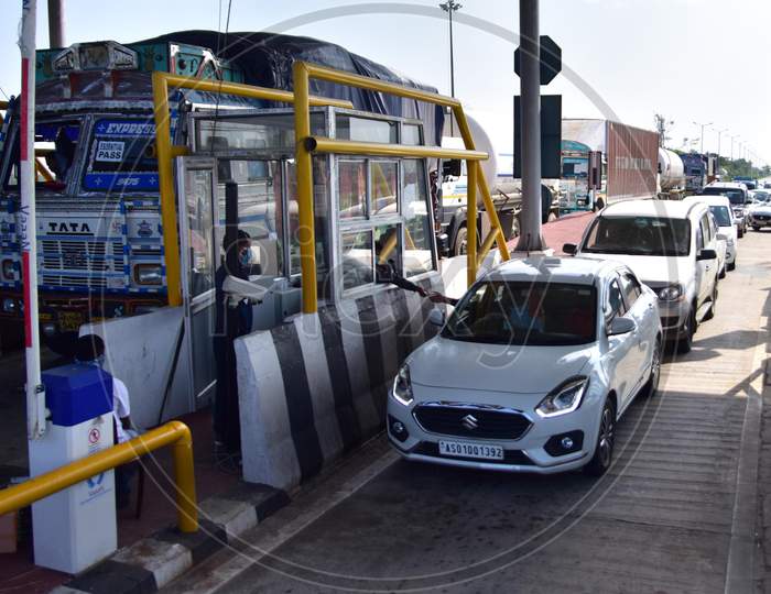 Cars Waiting To Pass Through  A Toll Plaza Of The National Highway Authority Of India (Nhai )After Authorities Allowed   With Certain Restrictions  During The Ongoing Covid-19 or Coronavirus  Nationwide Lockdown In Nagaon District Of Assam On May 4,2020