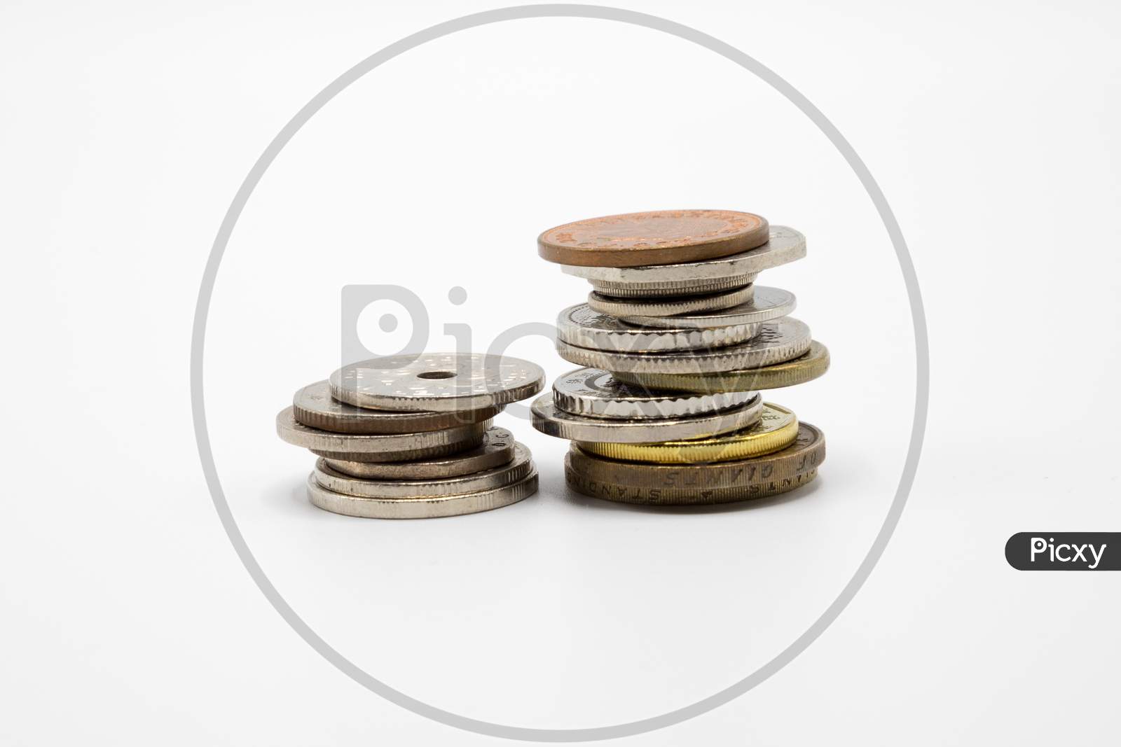 A pile of Currency Coins on White Background