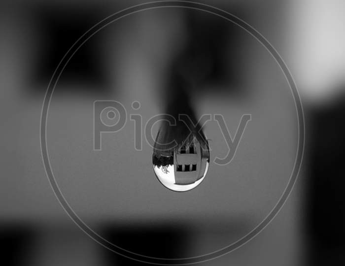 Image Of A Water Drop Reflection Of Building While Raining.-am550977-picxy