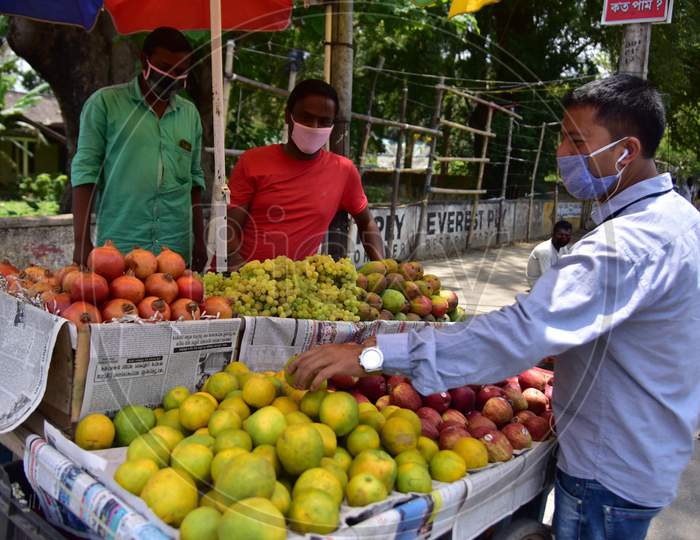 Nagaon :Vendor Sale Fruits  After Authorities Allowed Sale  With Certain Restrictions, During The Ongoing Covid-19 Nationwide Lockdown In Nagaon District Of Assam On May 04,2020 .Pix By Anuwar Hazarika