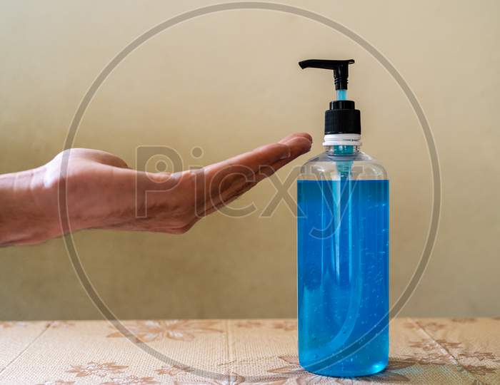 A bottle of hand sanitiser with hand