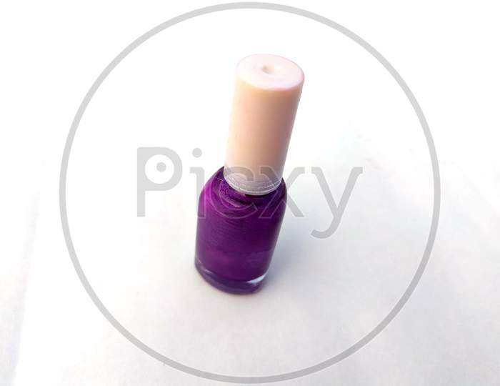 colorful nail polish glass bottle isolated on white background