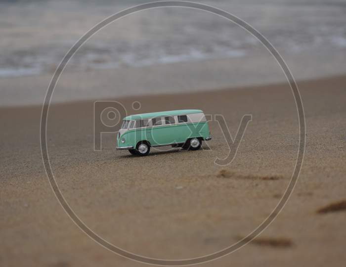 image of vintage toy van with beach background