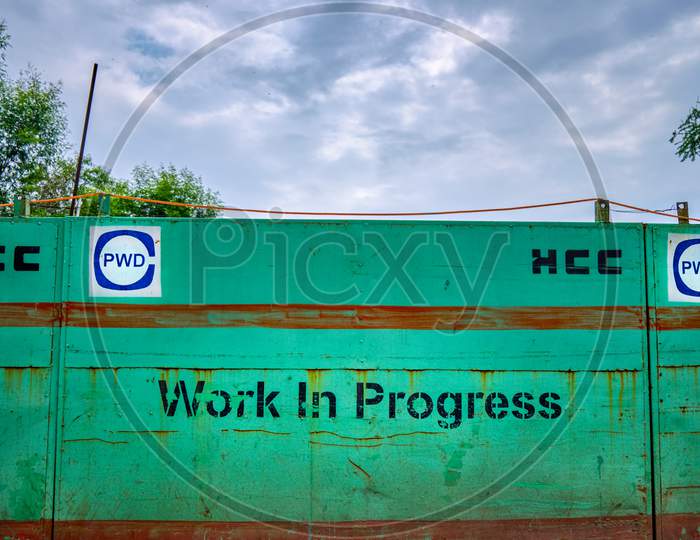 Work In Progress Sign In New Delhi, India. Hindustan Construction Company (Hcc) Contracted By The Public Works Department (Pwd) Of The Government Of Delhi