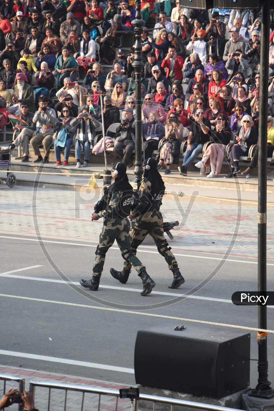 Indian crowd cheering and celebrating Border Security Force of Indian Army at Wagha Border, India. Amritsar, Punjab, India