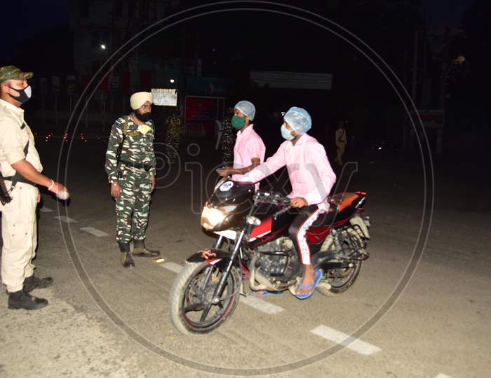 Security Personnel Question Commuters Who Defied Curfew In The Third Phase Of Covid-19 or Coronavirus Nationwide  Lockdown, In Nagaon District Of Assam On May 04,2020.