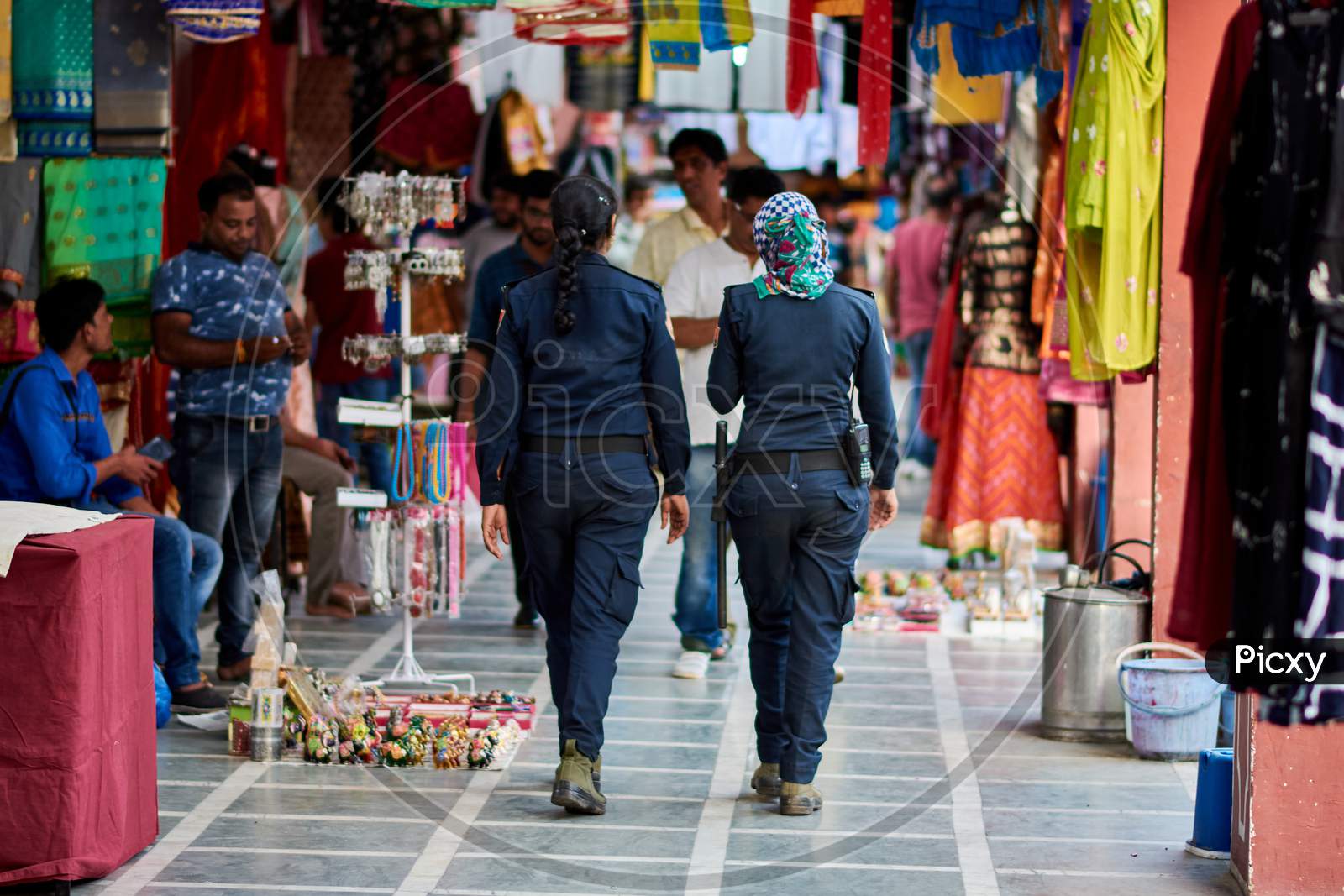 Indian Female Police Patrol At A Street Market In Jaipur, Rajasthan, India